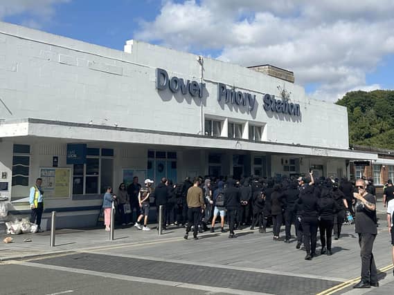 Protesters at Dover Priory train station after black-clad and masked anti-illegal migrant demonstrators blocked roads in the port