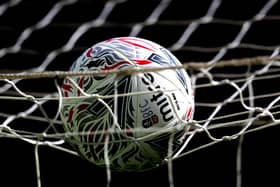 A general view of a matchball in a goalnet