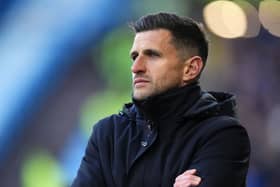 John Mousinho on the touchline