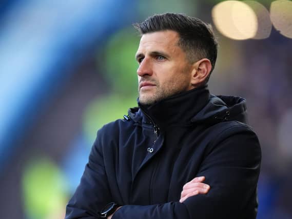 John Mousinho on the touchline