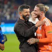 Schalke’s head coach Miron Muslic and goalkeeper Loris Karius celebrate their draw with Bayern Munich