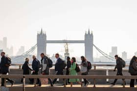 Commuters walking across London Bridge