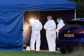 Grave exhumation work taking place at Fenns Meadow Green Burial Ground, Whitchurch due to a police investigation
