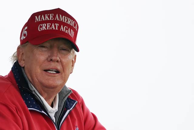 Donald Trump on the fourth hole at Trump International Golf Links & Hotel in Doonbeg, Co. Clare, during his 2023 visit to Ireland (Brian Lawless/PA)