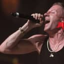 Macklemore performing on stage