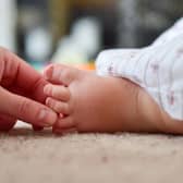 The foot of a young baby