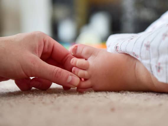 The foot of a young baby