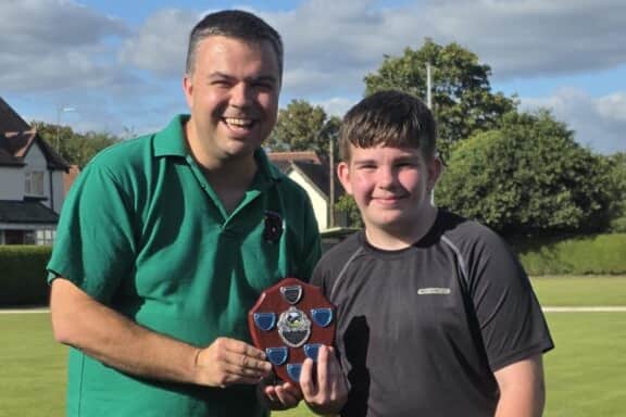 Proud as punch Pritchard- League Handicap winner Jamie Pritchard gets his reward from Rob Burroughs
