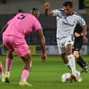 AFC Telford United left-back Mal Benning dribbles the ball on the edge of the Oxford City box