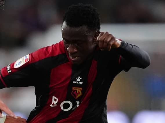 Watford's Mamadou Doumbia battles for the ball