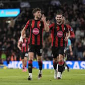 Ryan Christie, left, celebrates