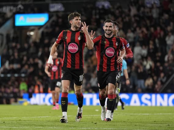 Ryan Christie, left, celebrates