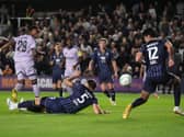 Joe Willock, left, scores