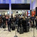 Passengers queue at airports as flights are delayed or cancelled