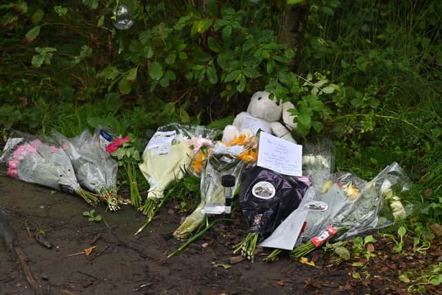 Floral tributes were being left at the site where the child died