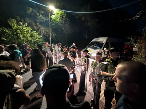 Protesters with police during a stand-off in Portsmouth on Sunday