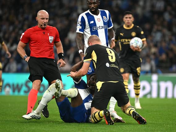 Manchester City’s Erling Haaland (right) and Porto’s Pablo Rosario clash after a challenge during Tuesday's Champions League match at the Estadio do Dragao