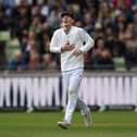 Theo Wylie gets the giggles after taking a catch as a substitute fielder to dismiss Shan Masood