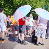 People use umbrellas for shade
