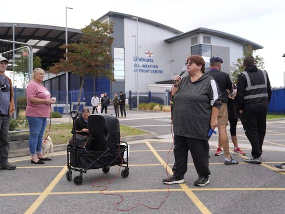Protesters outside an RNLI base