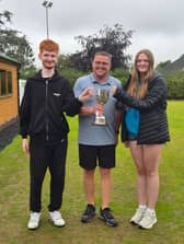 Smiles of winners – Dan Corbett and Hannah Gray with (centre) organiser Jack Hazeldine after the consolation final