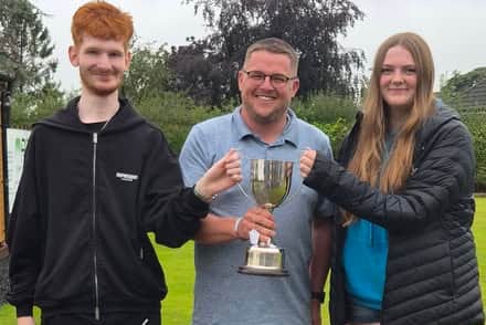 Smiles of winners – Dan Corbett and Hannah Gray with (centre) organiser Jack Hazeldine after the consolation final