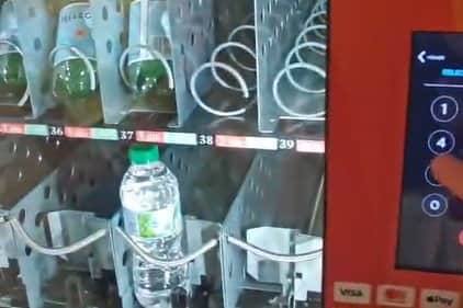 Broken vending machine at César Manrique-Lanzarote Airport, which Nathan Elliot said was the only source of acquiring water after the airport's shops closed.