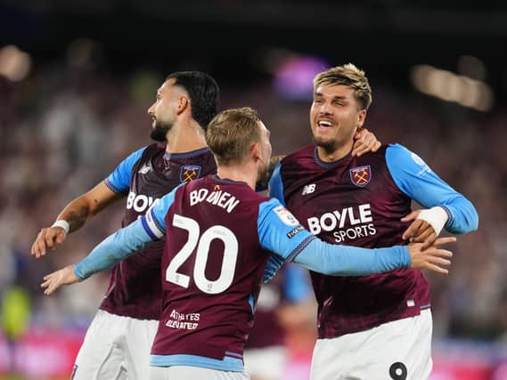 Joel Piroe, right, Taty Castellanos, left, and Jarrod Bowen celebrate