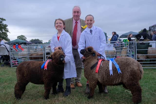 Lia Owen, eight from Newtown in Powys with her champion coloured Ryeland ewe lamb and Ottelie Mundy, nine of Willey Court, Willey, Preseteigne with her reserve champion ram lamb. It was the first time Ottelie has taken part in a show.