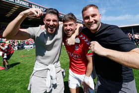 Alex Newby, centre, celebrates