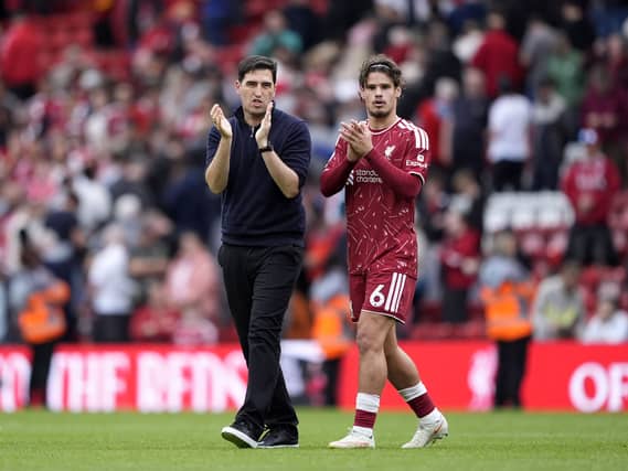 Liverpool manager Andoni Iraola and Milos Kerkez applaud the Liverpool fans (