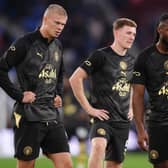 Erling Haaland, left, and Elliot Anderson, centre, have started the season well for City