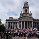 View of a group of protesters, with many waving UK and English flags