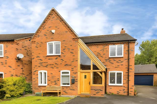 The detached Hatchetts Close property sits within a quiet residential setting