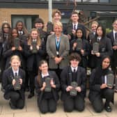 Principal Sarah Barton with students and their pouches

