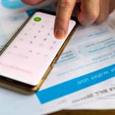 Person using a phone calculator