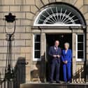 Catherine Connolly and John Swinney outside the door to Bute House