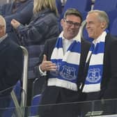 Andy Burnham and Mark Carney in the stands wearing Everton scarves