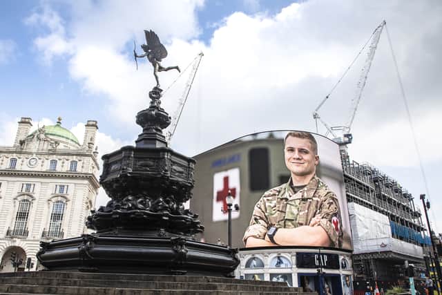 Portraits of Armed Forces personnel appeared on the billboards of Piccadilly Circus (SAC Beth Roberts RAF/MoD)