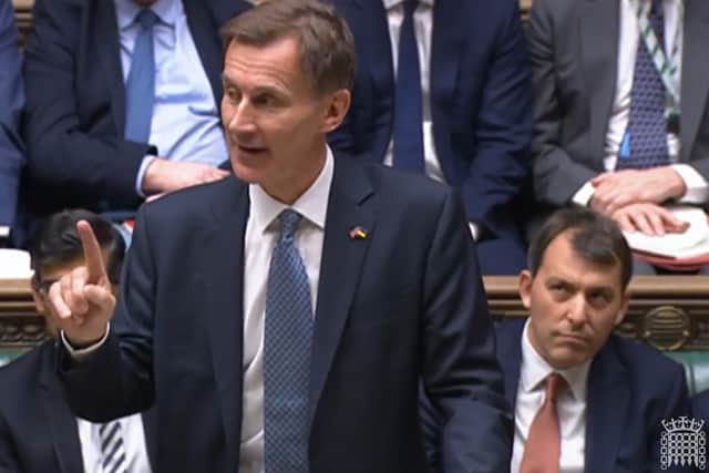 Chancellor of the Exchequer Jeremy Hunt delivers his autumn statement (House of Commons/PA)