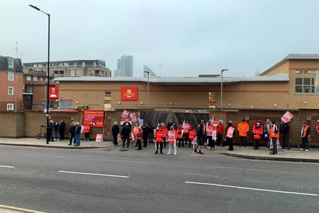 Striking postal workers outside the Royal Mail Islington delivery office (Lucas Cumiskey/PA)