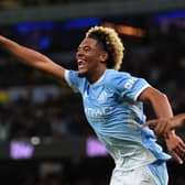 Floyd Samba celebrates scoring for Man City