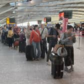 Passengers at Heathrow Airport in west London, during disruption after a system issue hit Nats