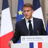 French President Emmanuel Macron gestures as he addresses the audience during a press conference