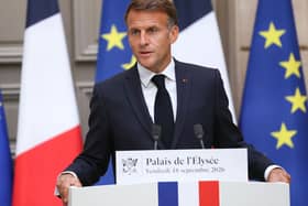 French President Emmanuel Macron gestures as he addresses the audience during a press conference