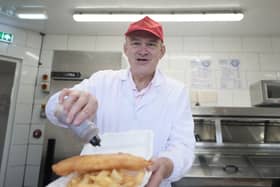 Liberal Democrat leader Sir Ed Davey serving up fish and chips at Brighton Palace Pier