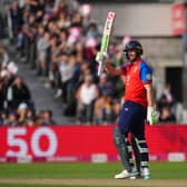England’s Jos Buttler celebrates reaching 50 runs during the Third Vitali