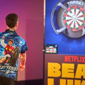 Zac Spain throws a dart