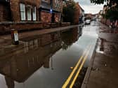 Torrential rain caused Cheshire Street in Market Drayton to flood in August