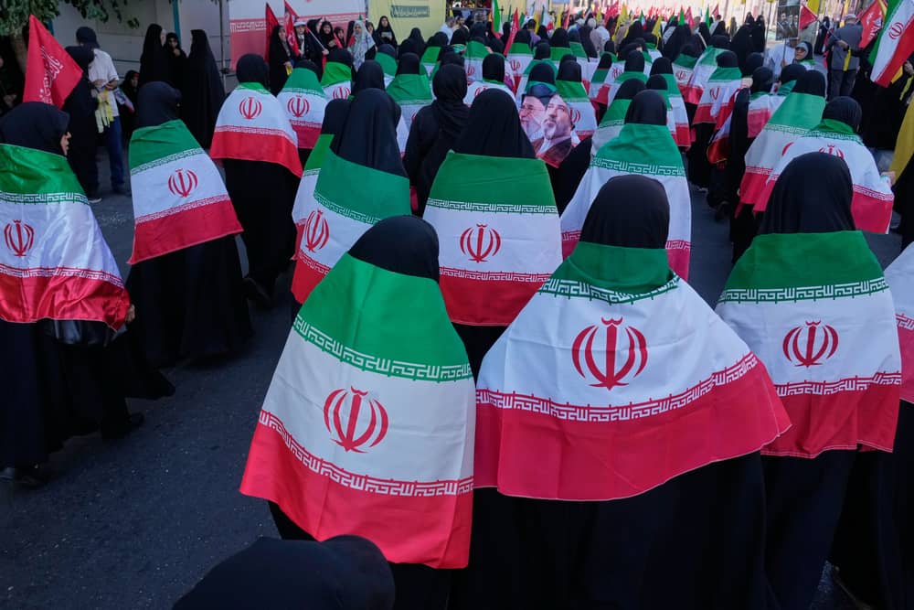 Iran stages massive Tehran rally as volunteers pledge to take up arms, in photos